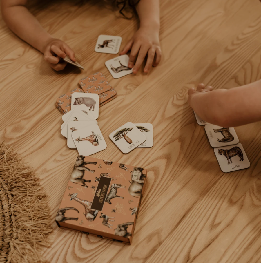 Children playing with an African animals themed memory game.